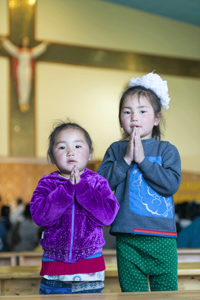 Mongolia, girls praying, World Mission Sunday poster 2015