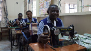 Young women working on sewing machines