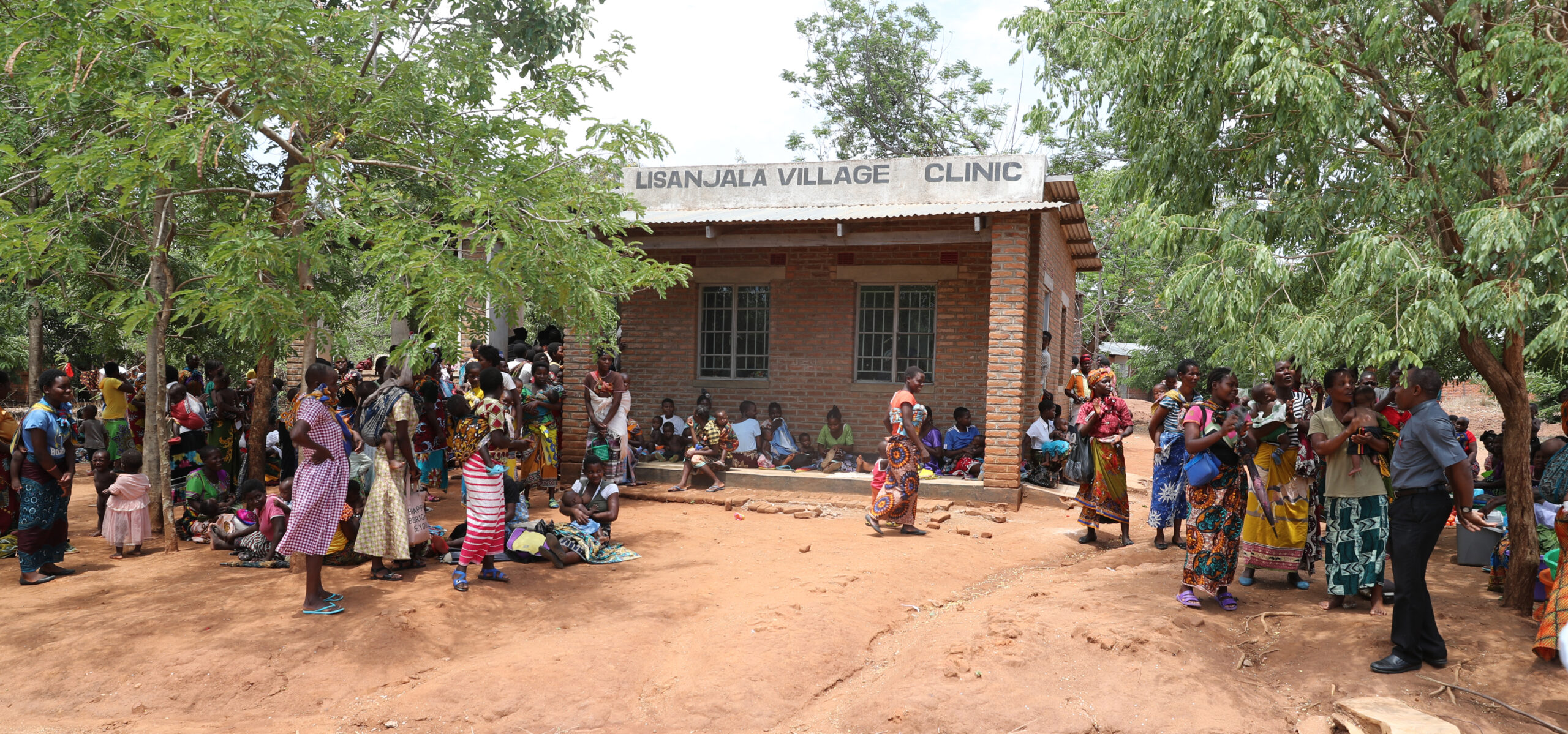 Mothers waiting for their sick children to be seen at Lisanjala Health Clinic in Malawi