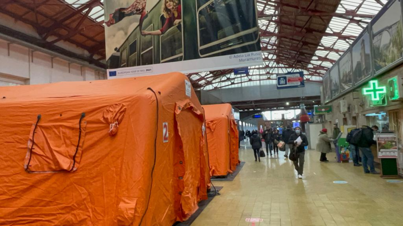 Large orange emergency tents in Romanian train station