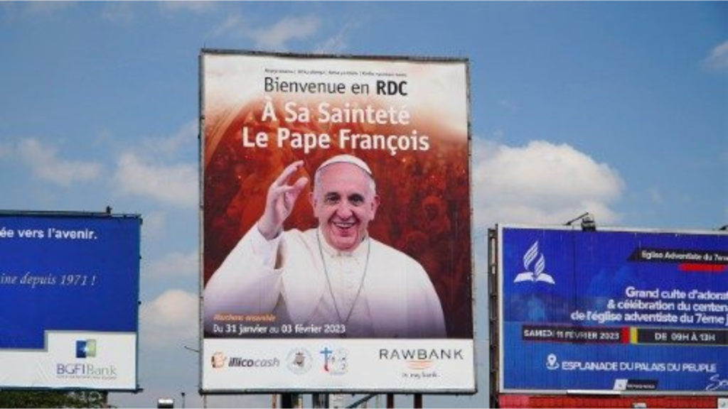 Billboards with welcome signs featuring Pope Francis in DR Congo