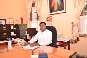 Fr Expeditus, the Rector of Our Lady of Lanka Seminary in Sri Lanka, sits at his desk in his office