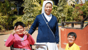 A missionary Sister with children who have special needs