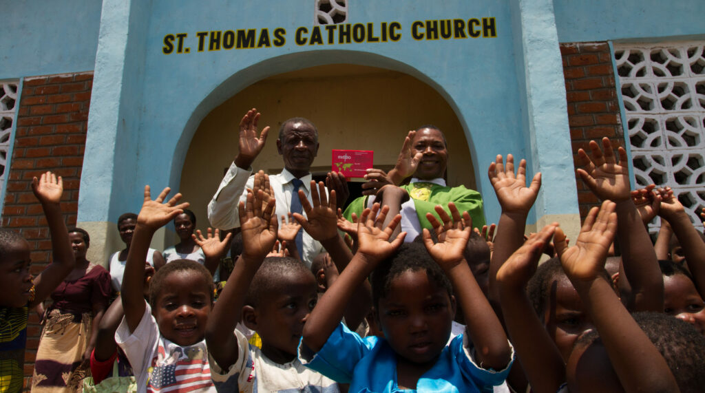 Fr Henry in Malawi with the Red Box at St Thomas' Catholic Church